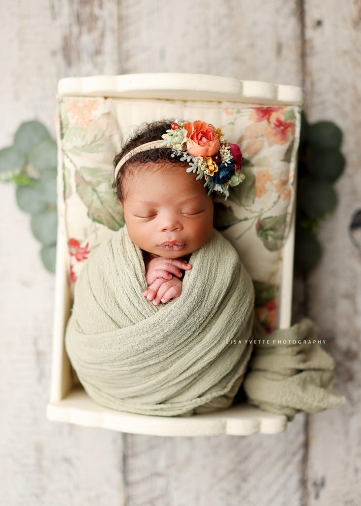 African American newborn posed by Lisa Yvette - Charlotte Photographer