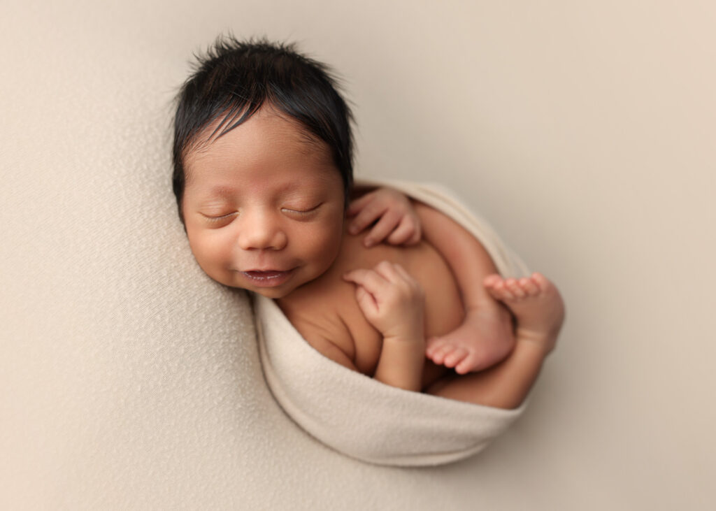 smiling newborn boy