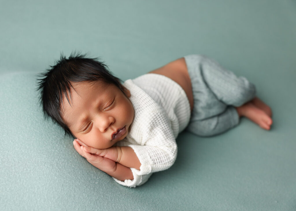 newborn boy side lay pose